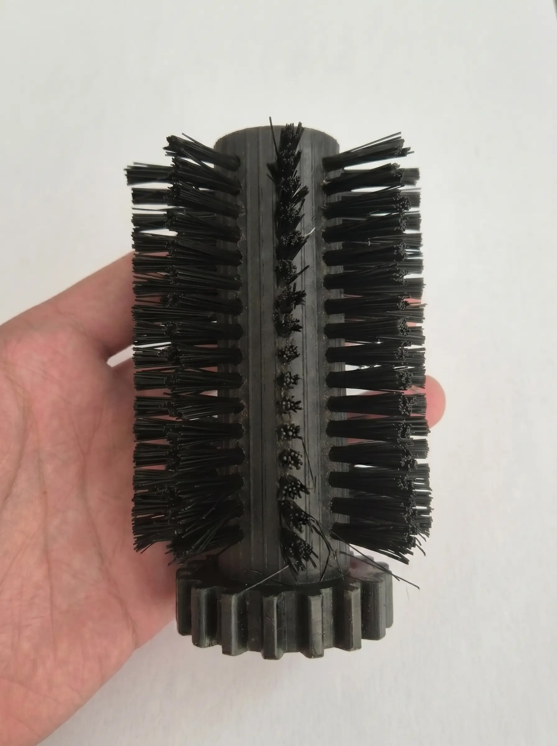 Original damaged OEM roller in hand