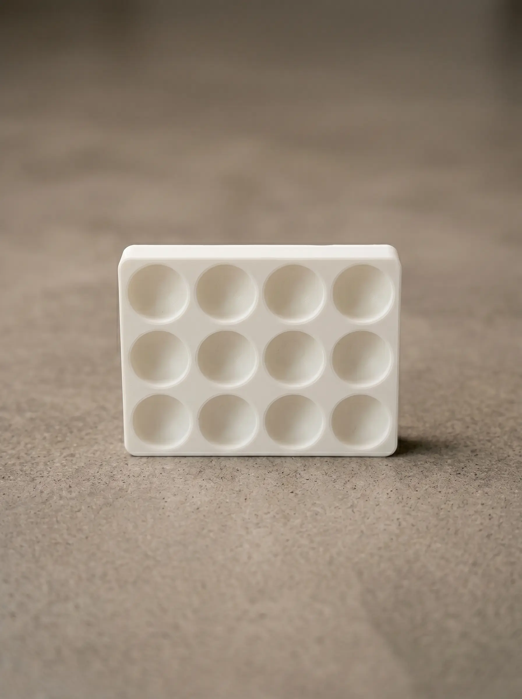 Vacuum-forming positive — 12-cavity hemispherical dimple mold, printed in PLA